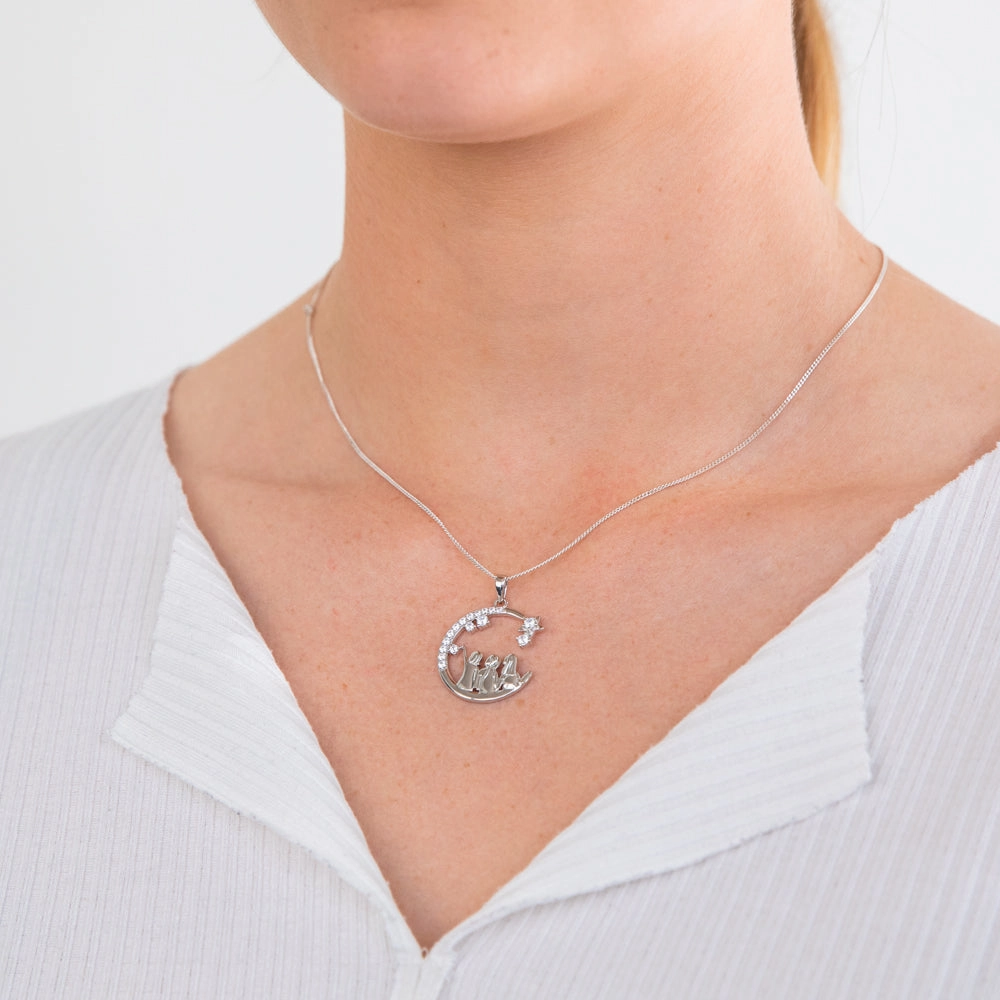 Sterling Silver And Rhodium Cubic Zirconia Half Moon With Three Sisters Pendant